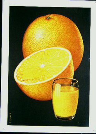 a glass of orange juice next to a half of orange