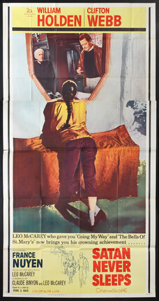 a poster of a woman sitting on a couch