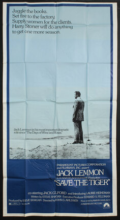 a poster of a man standing on a desert