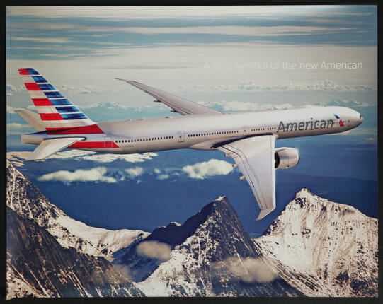 an airplane flying over mountains