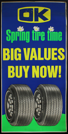 a blue sign with yellow text and tires