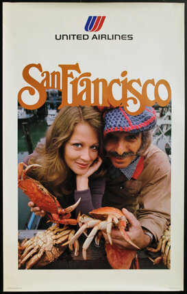 a man and woman holding crabs