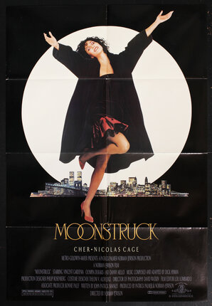 movie poster with a woman (Cher) walking with her arms wide under a giant full moon and a city skyline behind her