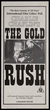 a movie poster with a man holding tugging the hair of another man