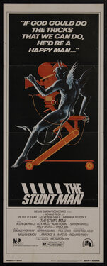 movie poster with a naked devil sitting at the controls of a movie film reel camera